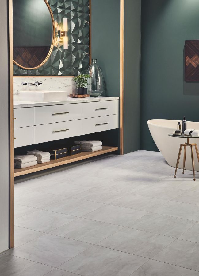 gray luxury vinyl tile flooring in a green bathroom